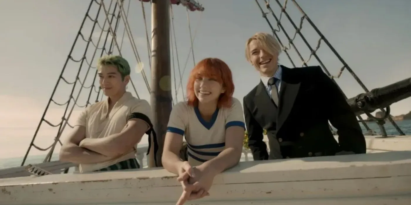 Mackenyu as Zoro, Emily Rudd as Nami, and Taz Skylar as Sanji smile aboard the Going Merry in One Piece Mackenyu as Zoro, Emily Rudd as Nami, and Taz Skylar as Sanji smile aboard the Going Merry in One Piece
