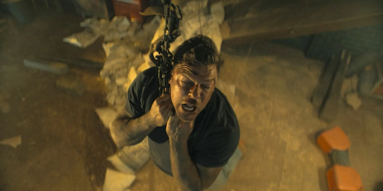 Jack Reacher hanging by his neck from a chain in Reacher Season 3 Ep 8