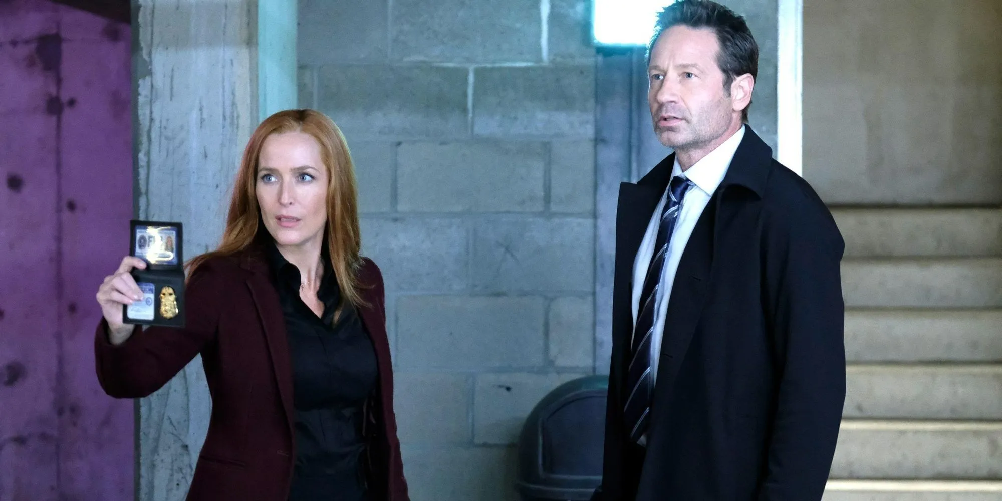 Scully showing her badge