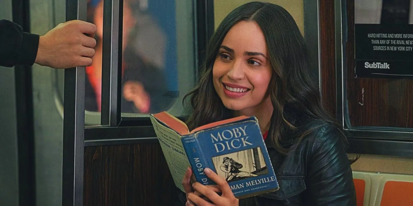 Sofia Carson holding Moby Dick on the subway in The Life List Sofia Carson holding Moby Dick on the subway in The Life List