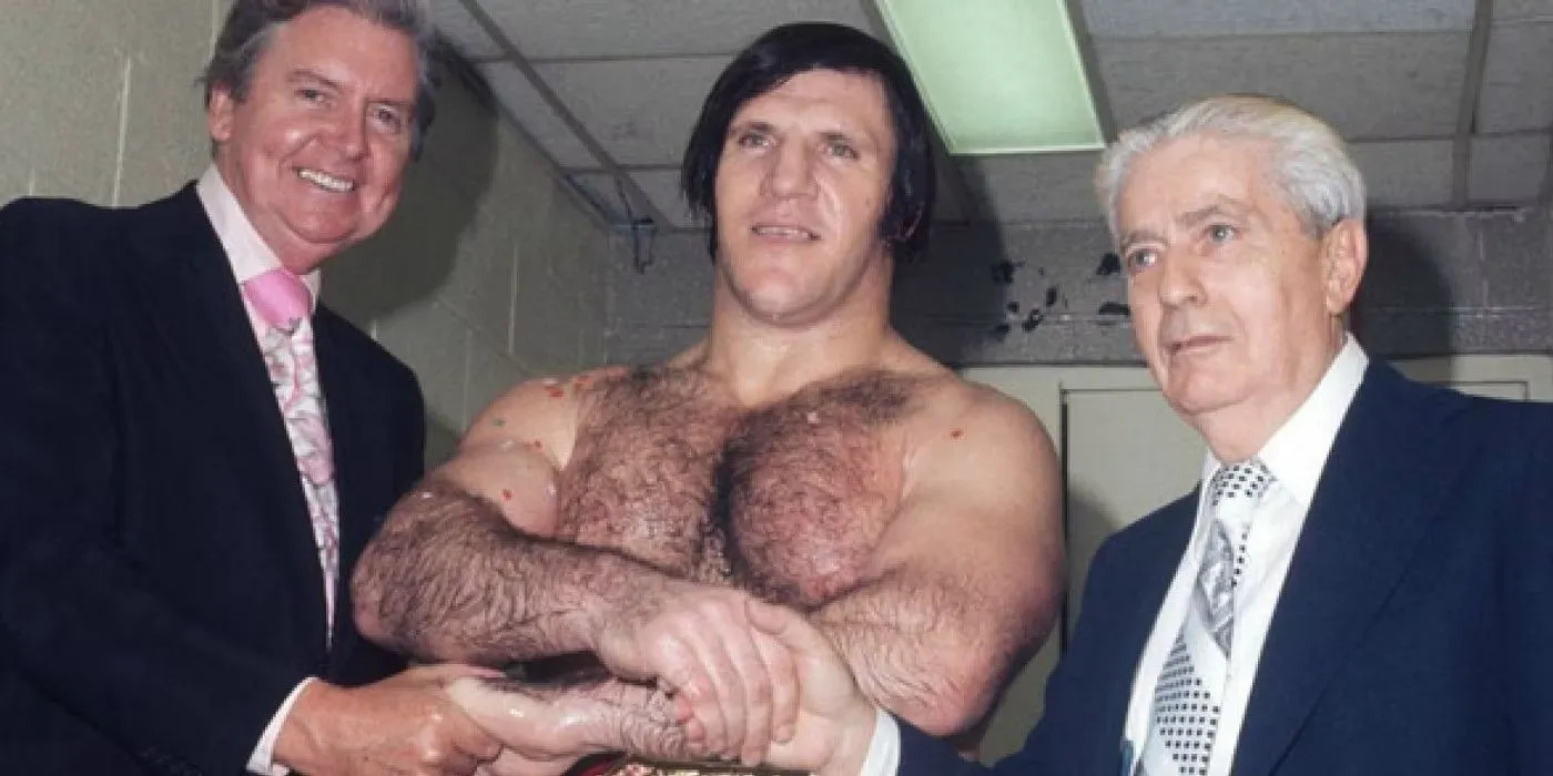 Vince McMahon Sr shaking the hand of longest reigning WWE Champion Bruno Sammartino