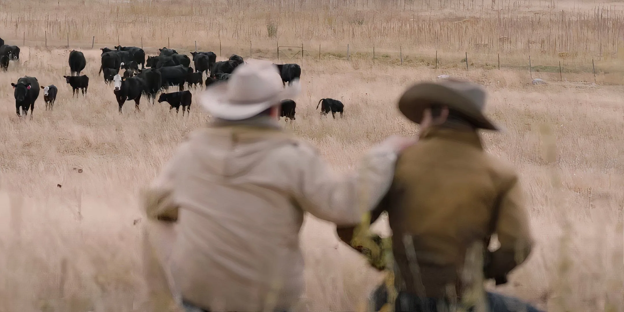 Kevin Costner's John Dutton with another cowboy in Yellowstone season 1