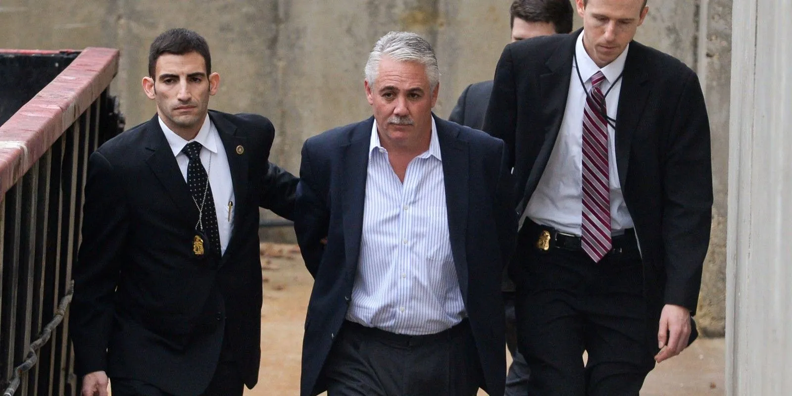 James Burke being led away by officers