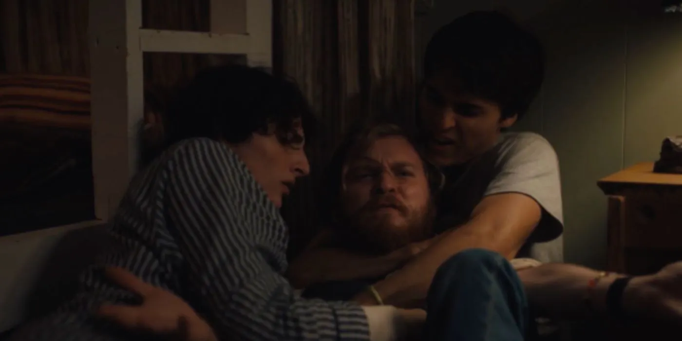 Finn Wolfhard and another boy tackling Fred Hechinger in Hell of a Summer Finn Wolfhard and another boy tackling Fred Hechinger in Hell of a Summer