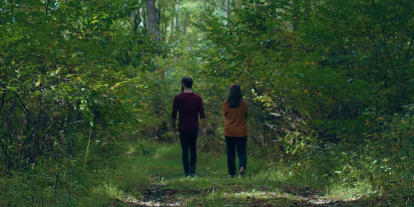 825 Forest Road Chuck and Isabel walking in the woods