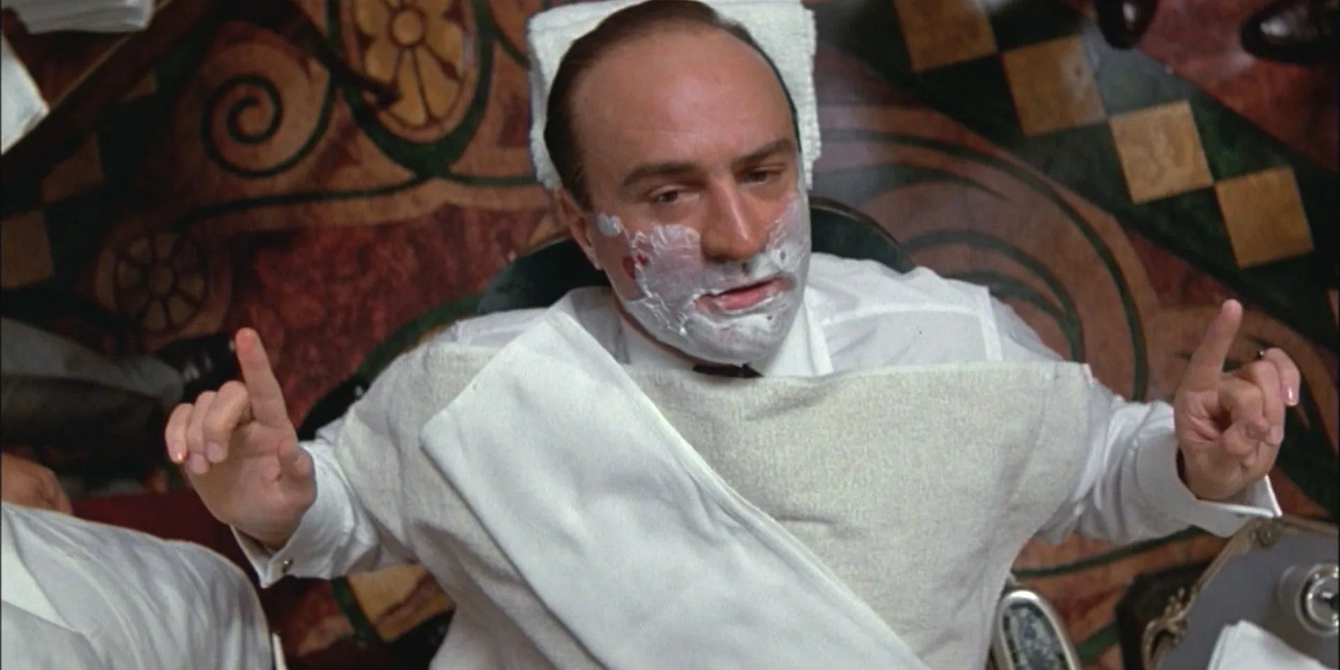 Robert De Niro as Al Capone chats with a reporter while getting a shave in The Untouchables Robert De Niro as Al Capone chats with a reporter while getting a shave in The Untouchables