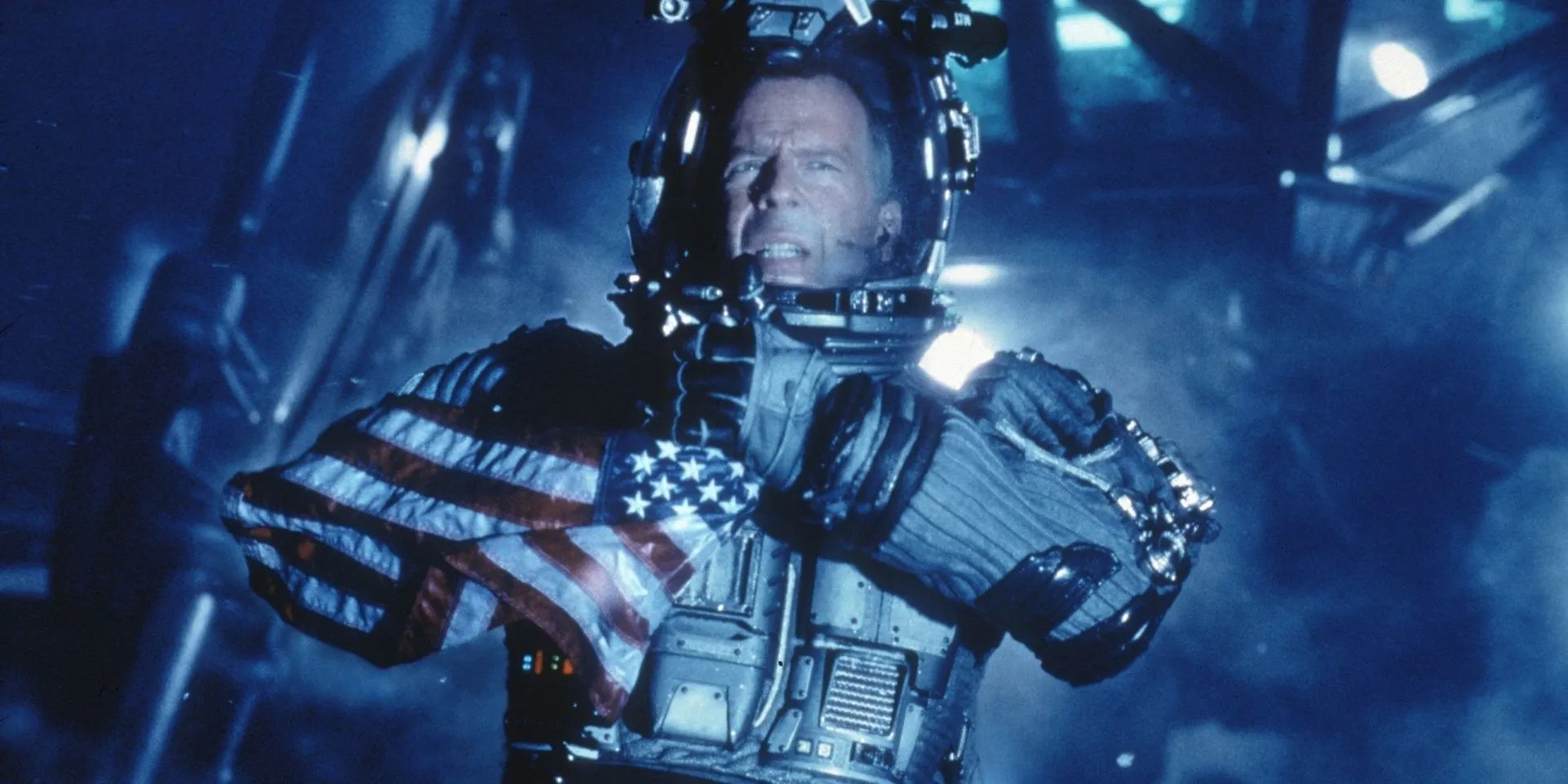 Harry (Bruce Willis) secures the American flag after landing on the asteroid in Armageddon Harry (Bruce Willis) secures the American flag after landing on the asteroid in Armageddon