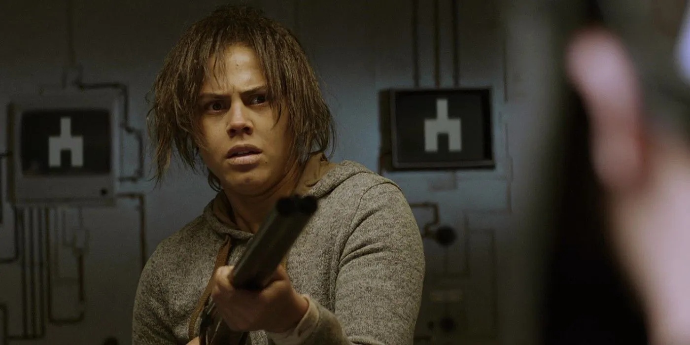 Victoria points a gun at someone in the Black Mirror episode White Bear Victoria points a gun at someone in the Black Mirror episode White Bear