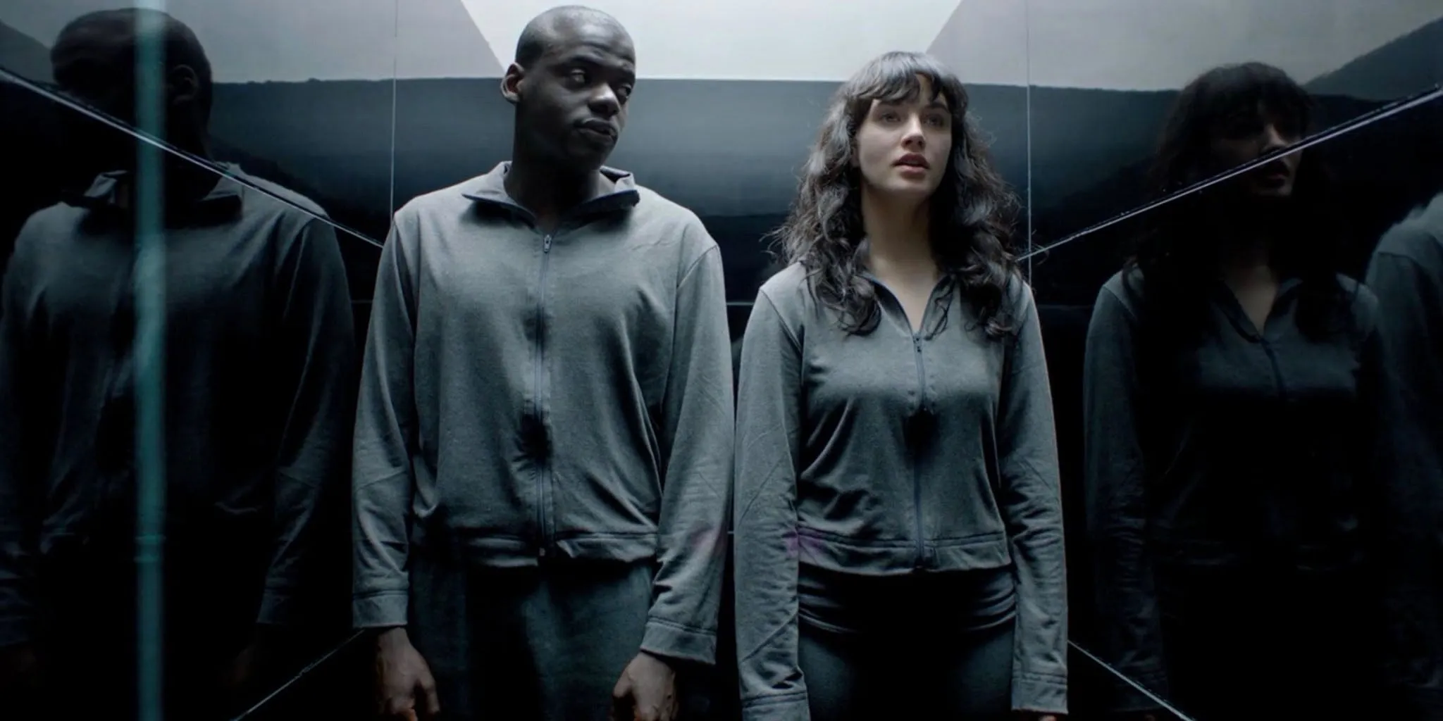 Bing and Abi in an elevator in Fifteen Million Merits in Black Mirror. Bing and Abi in an elevator in Fifteen Million Merits in Black Mirror.