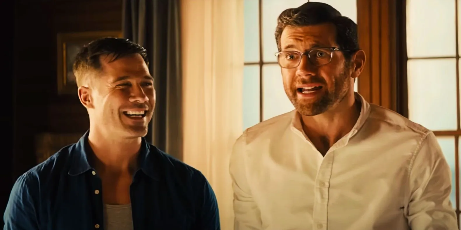Billy Eichner as Bobby and Luke Macfarlane as Aaron laughing in Bros