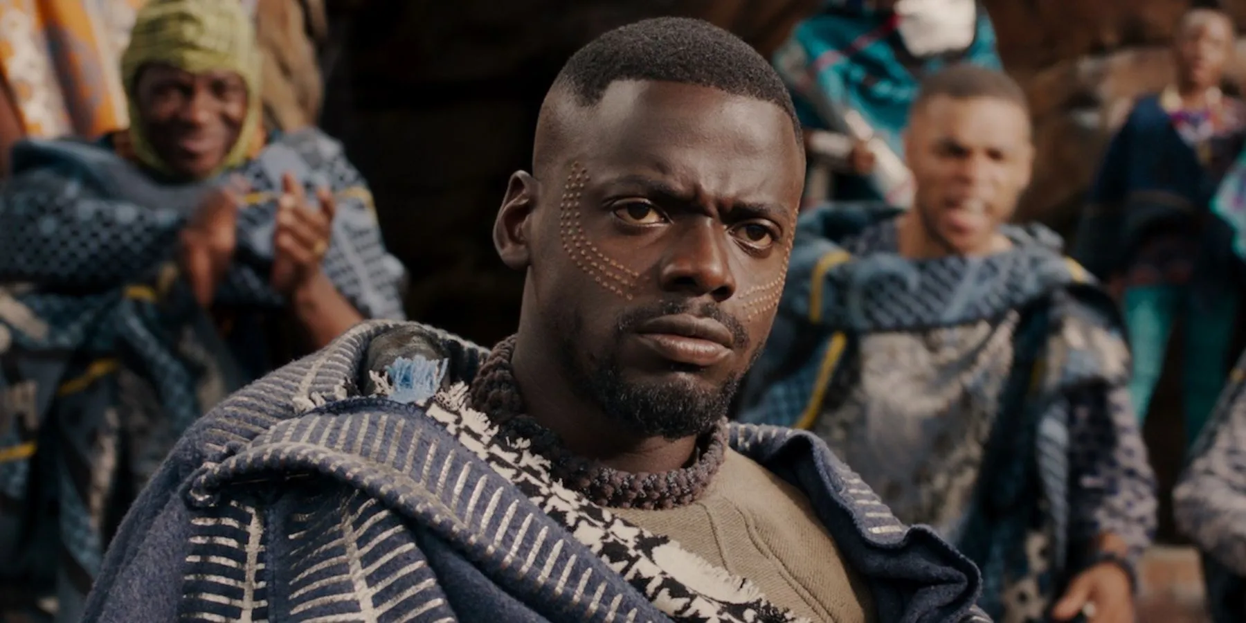 Daniel Kaluuya as W'Kabi in front of shouting Wakandans in Black Panther