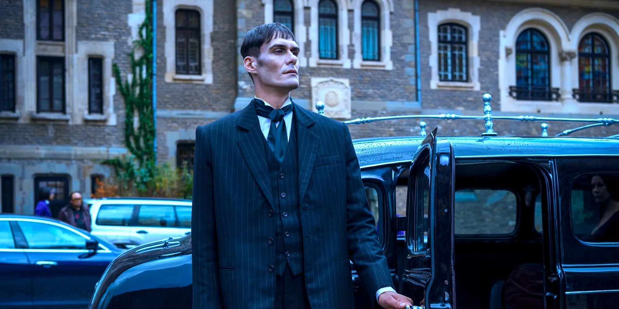 George Burcea as Lurch opening the car door in Wednesday on Netflix George Burcea as Lurch opening the car door in Wednesday on Netflix