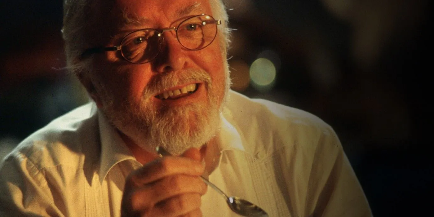 David Attenborough as John Hammond smiling in Jurassic Park.