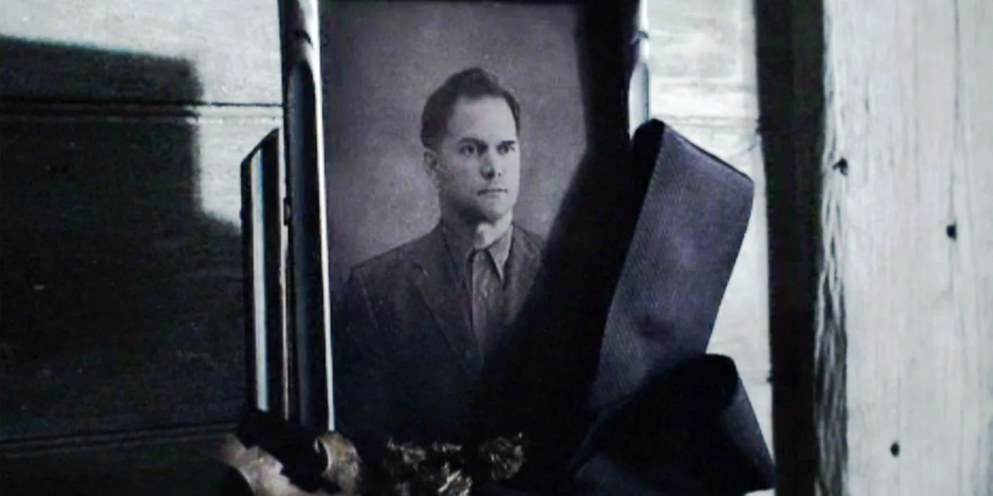 A framed picture of Katniss' father on display