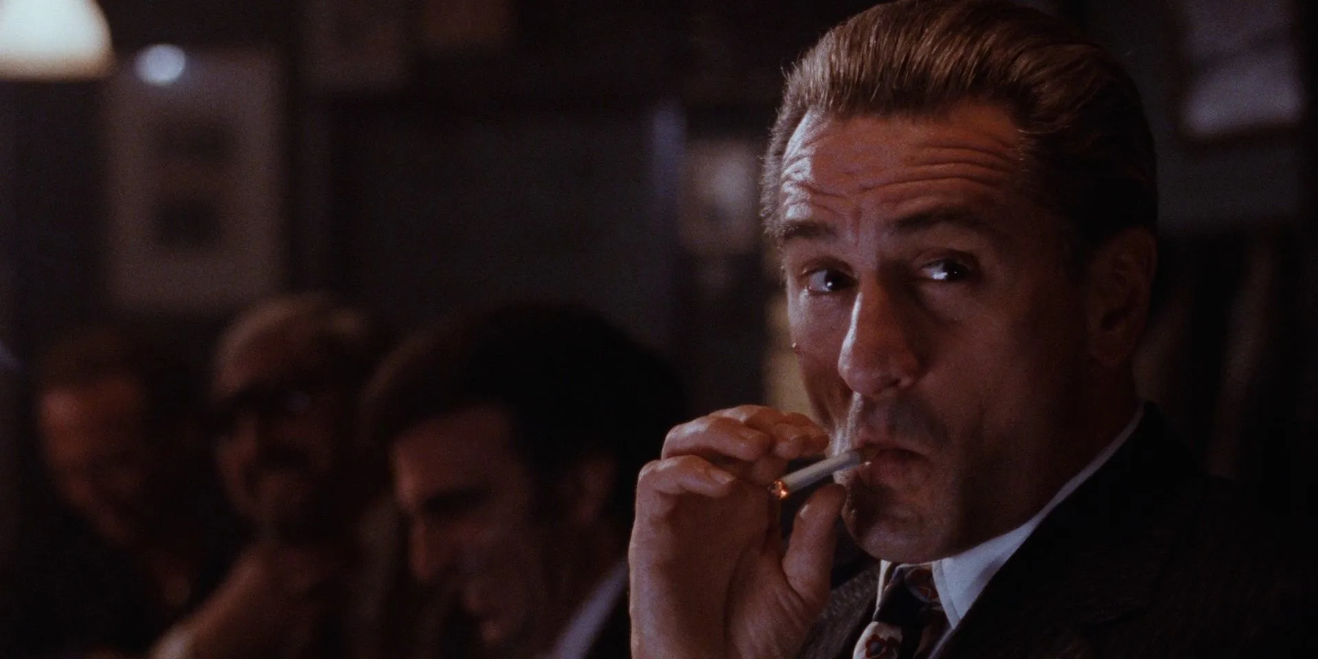 Jimmy Conway (Robert De Niro) smoking a cigarette in a bar in Goodfellas Jimmy Conway (Robert De Niro) smoking a cigarette in a bar in Goodfellas