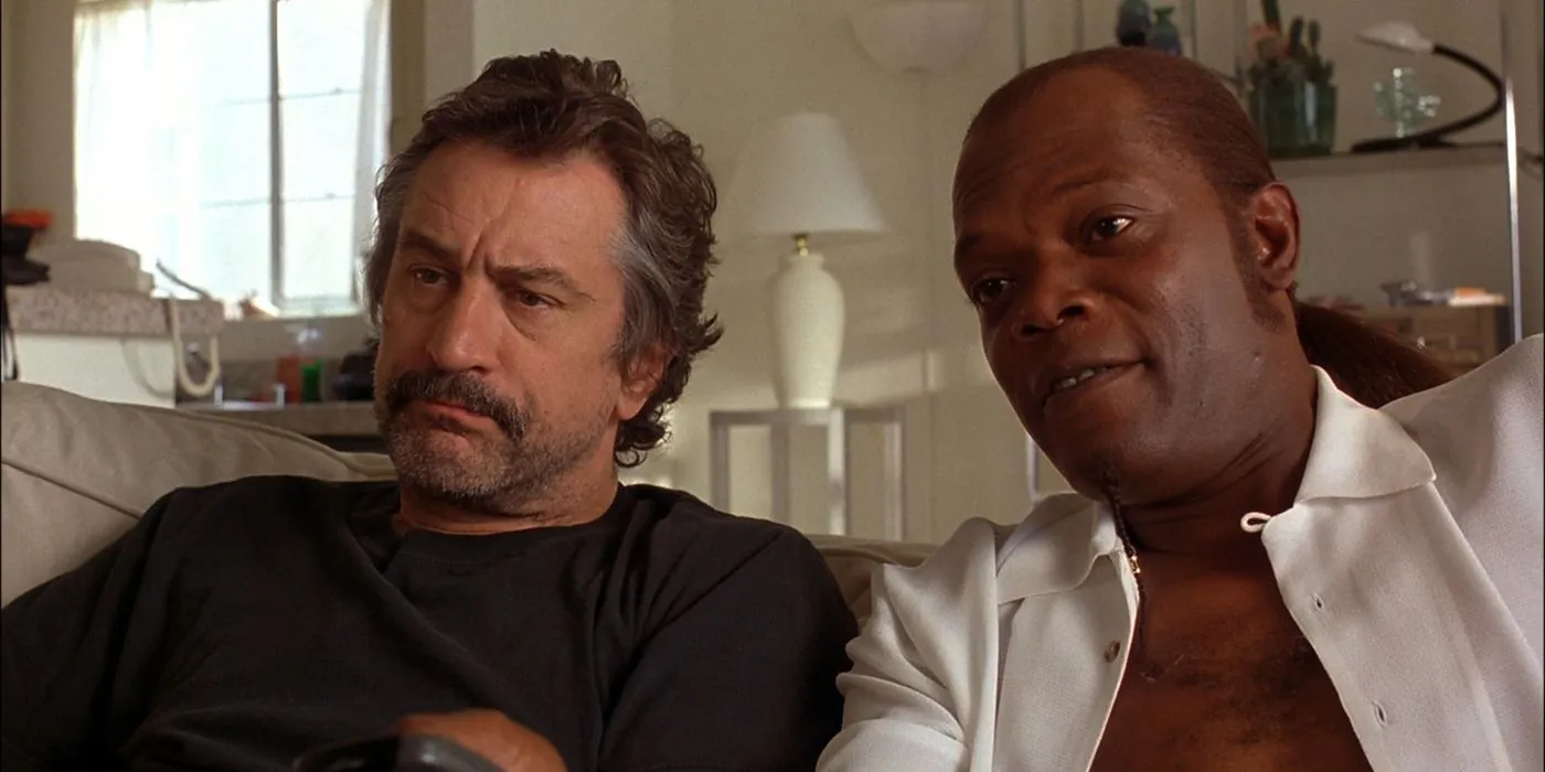 Robert De Niro and Samuel L Jackson sitting on a couch in Jackie Brown. Robert De Niro and Samuel L Jackson sitting on a couch in Jackie Brown.