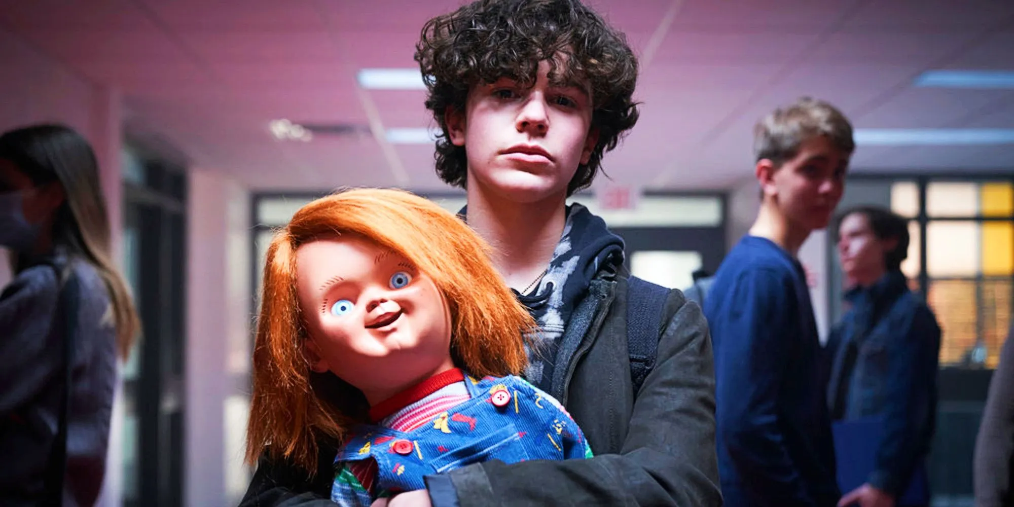 Zackary Arthur as Jake Wheeler holding Chucky Zackary Arthur as Jake Wheeler holding Chucky