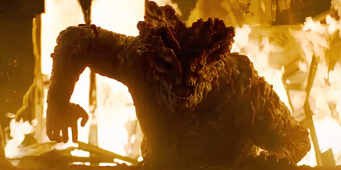 A Bloater rises from the flames in The Last of Us A Bloater rises from the flames in The Last of Us