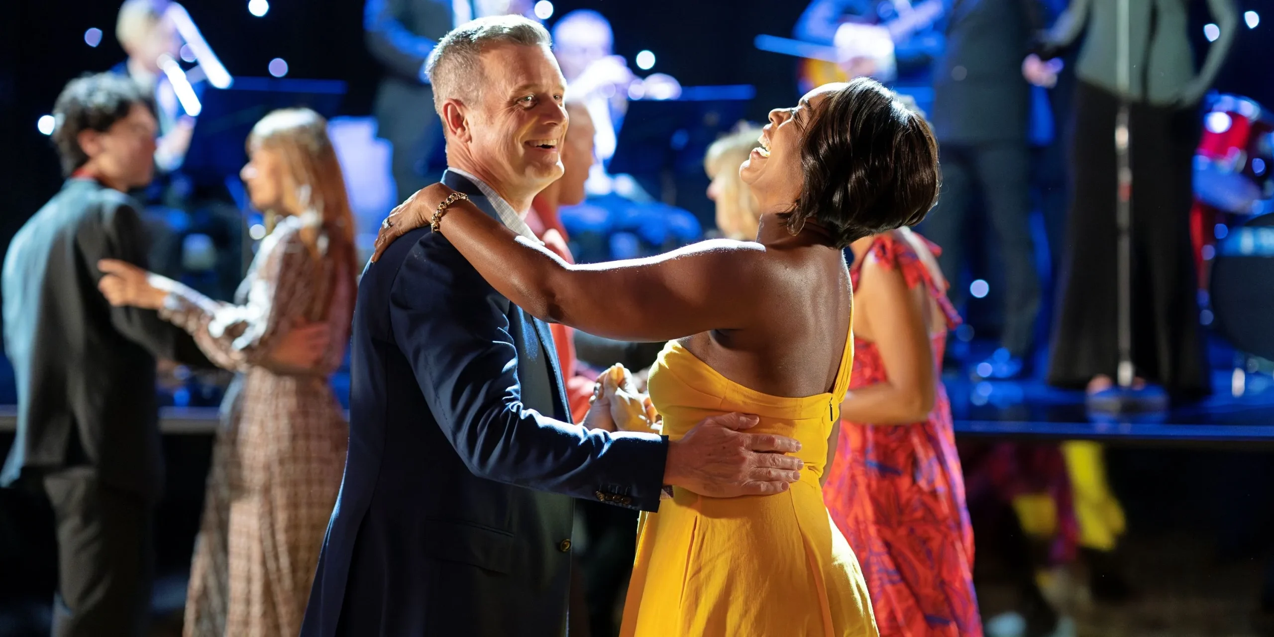 Angela Bassett as Athena Grant-Nash and Peter Krause as Bobby Nash dancing on a cruise ship in 9-1-1 season 7.
