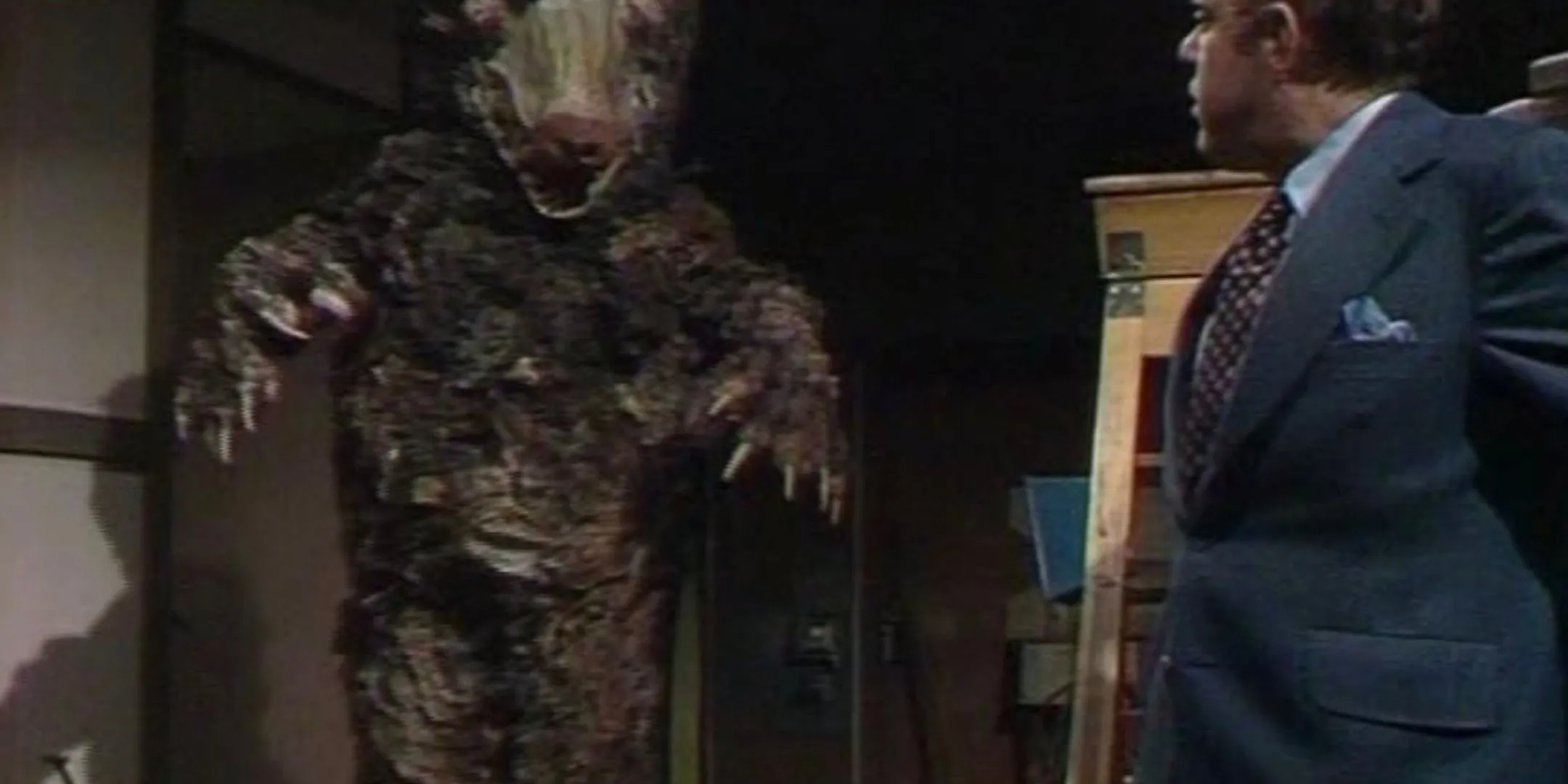 A strange, large hybrid monster approaches a man. A strange, large hybrid monster approaches a man.