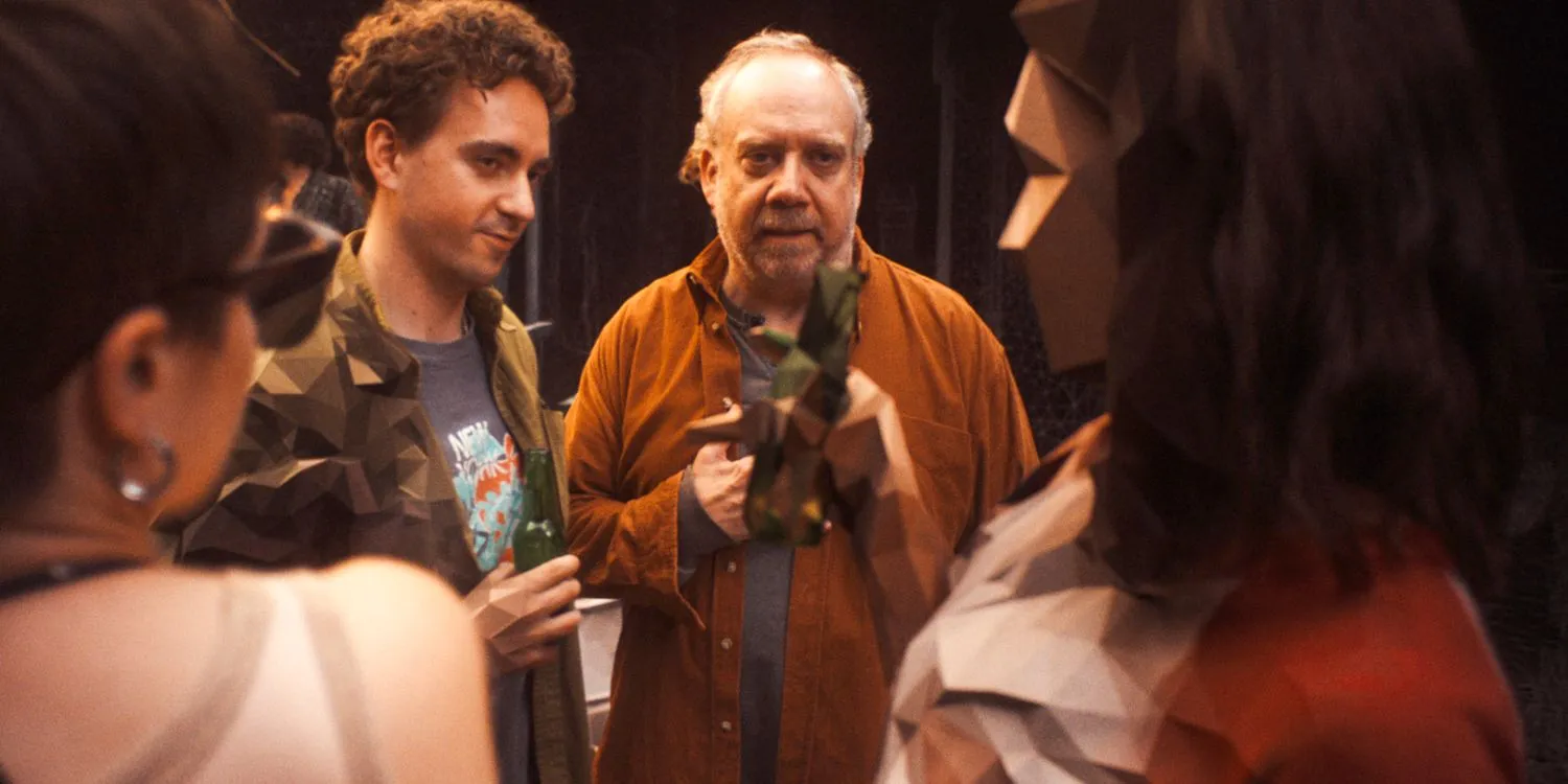 Phillip (Paul Giamatti) watching a group of people frozen and pixelated in Black Mirror Season 7 Ep 5 Phillip (Paul Giamatti) watching a group of people frozen and pixelated in Black Mirror Season 7 Ep 5