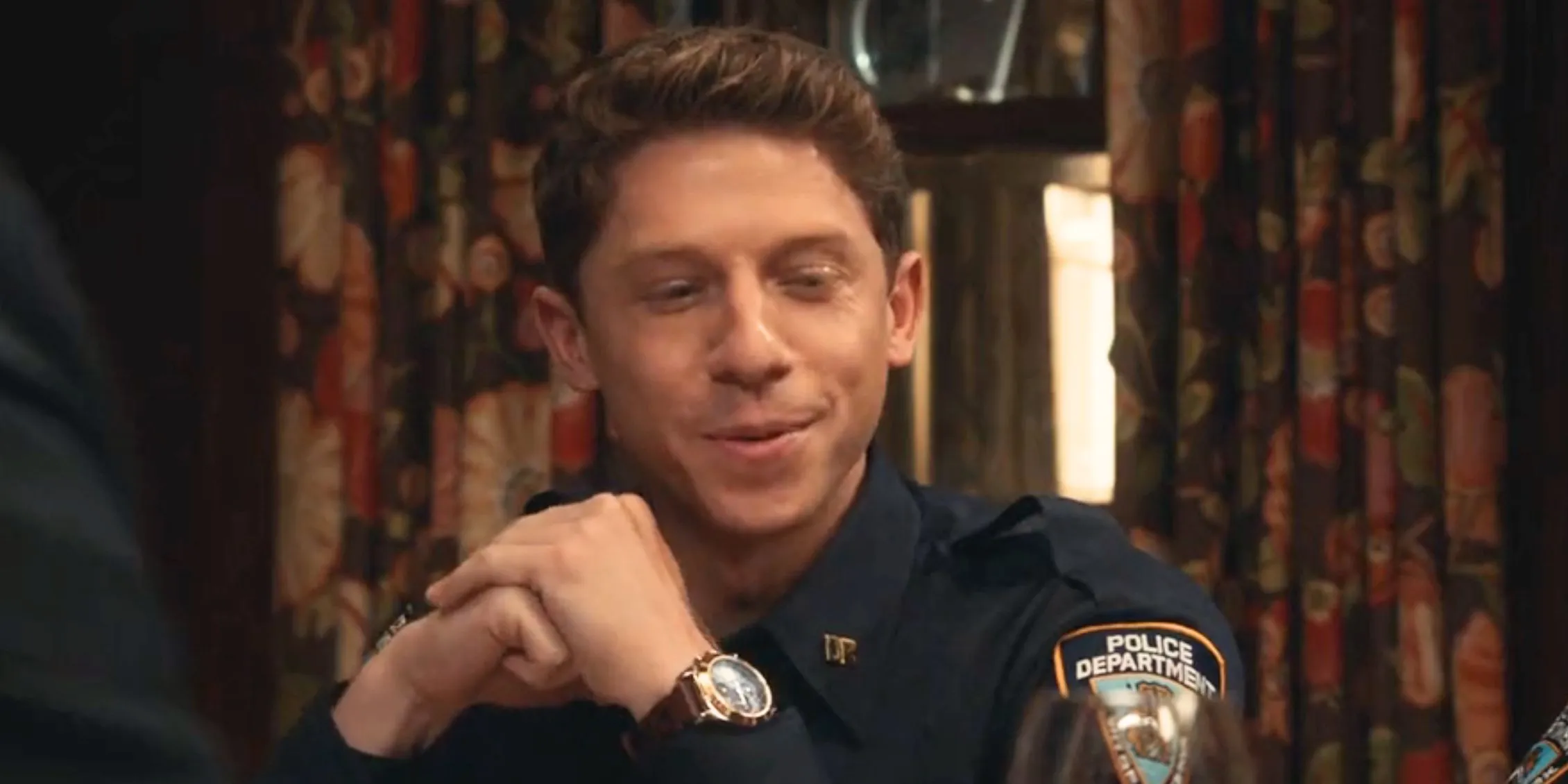Blue Bloods Joe Hill sitting at the family dinner table in his police uniform Blue Bloods Joe Hill sitting at the family dinner table in his police uniform