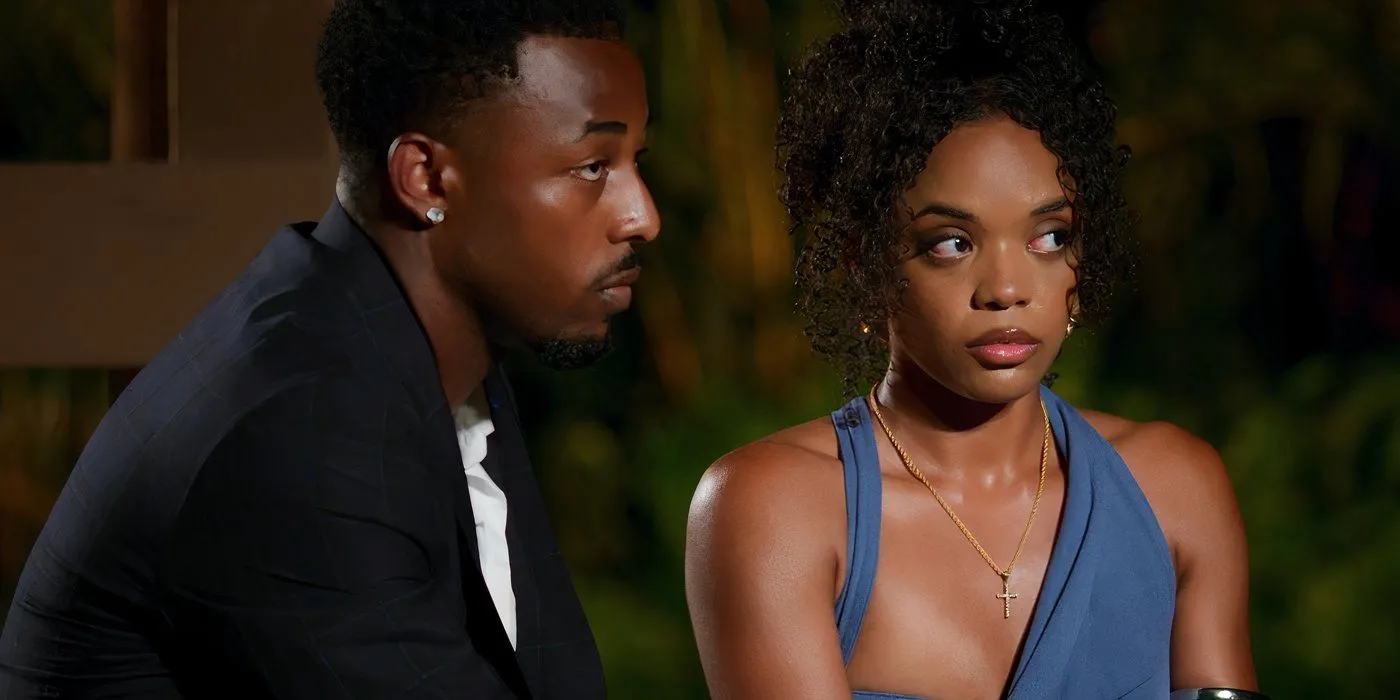Temptation Island's Brion Whitley and Shante Glover sitting together and looking tense at a bonfire Temptation Island's Brion Whitley and Shante Glover sitting together and looking tense at a bonfire