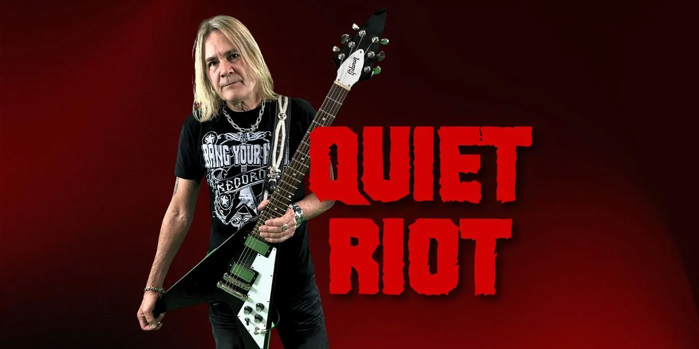 Guitarist Carlos Cavazo alongside the Quiet Riot band logo