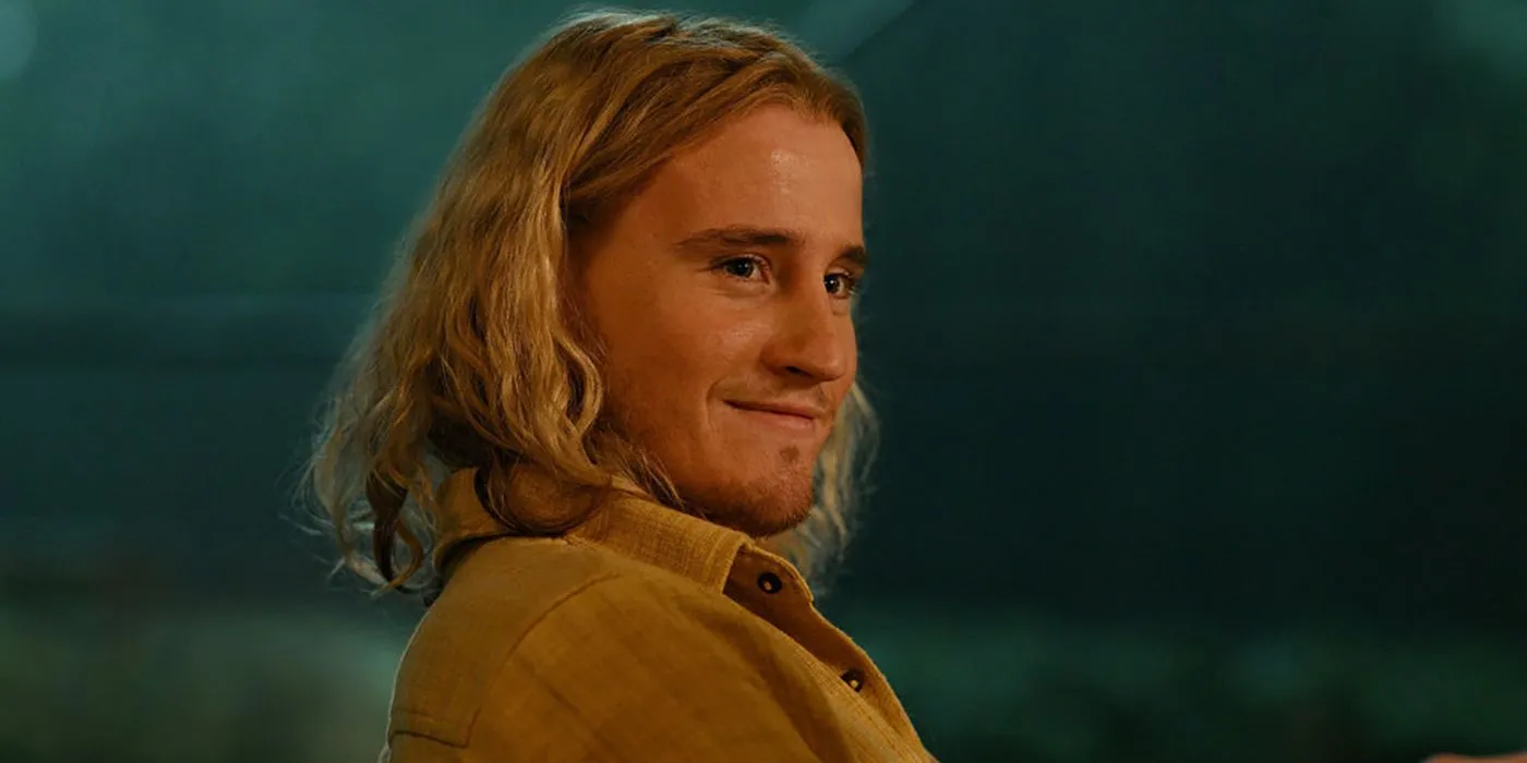 Conor Merrigan Turner as Logan smiling in Apples Never Fall Conor Merrigan Turner as Logan smiling in Apples Never Fall