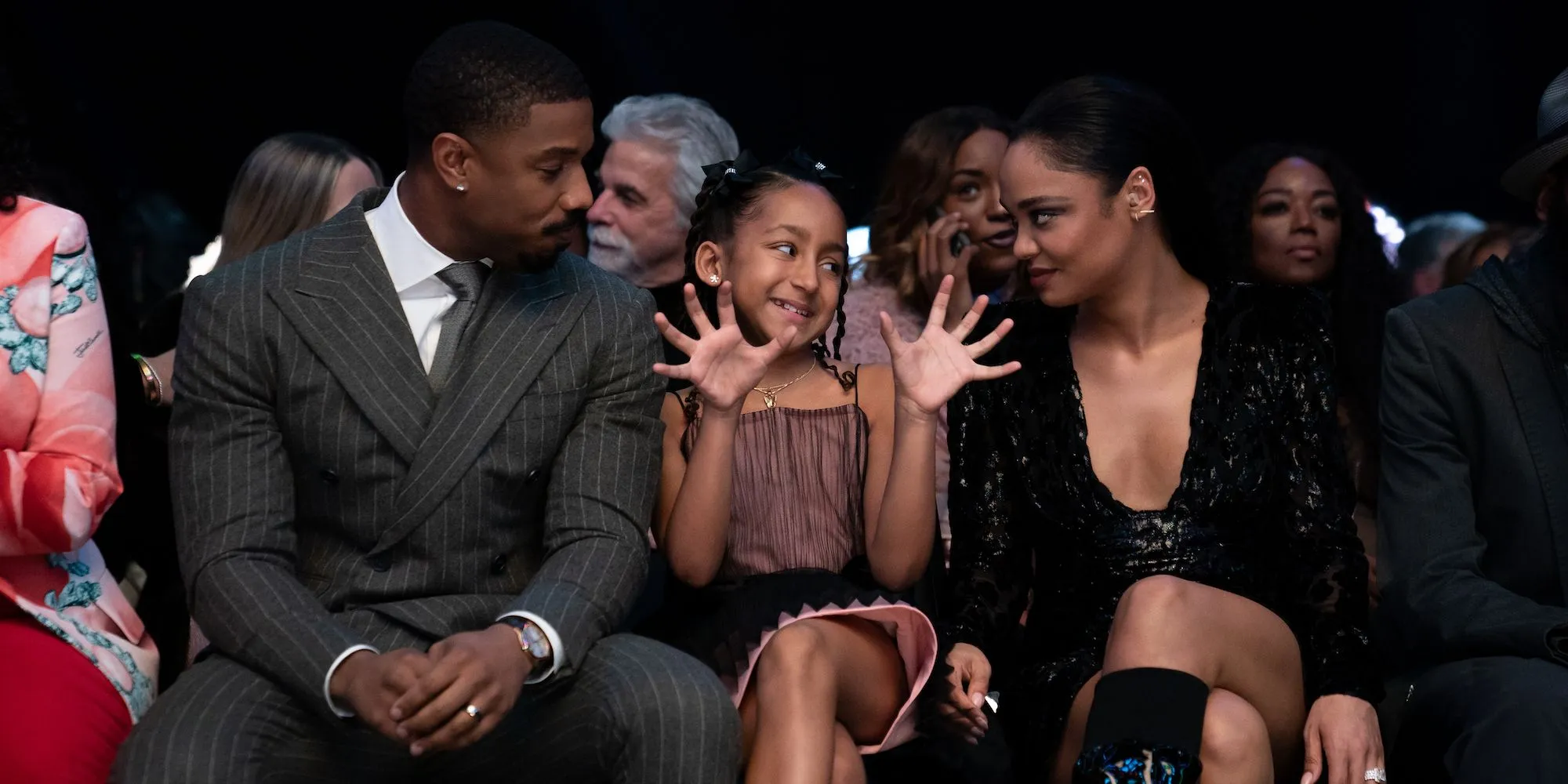 Donnie and Bianca sit with Amara in Creed III