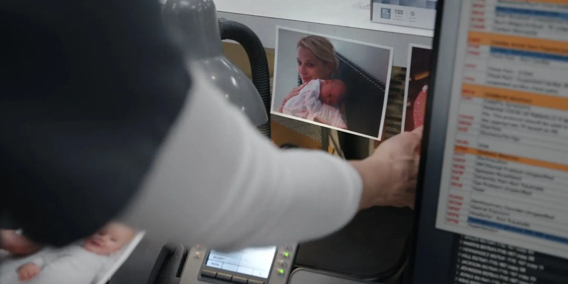 Dana Evans (Katherine LaNasa) taking down family photos from her work station in The Pitt season 1, episode 15 Dana Evans (Katherine LaNasa) taking down family photos from her work station in The Pitt season 1, episode 15