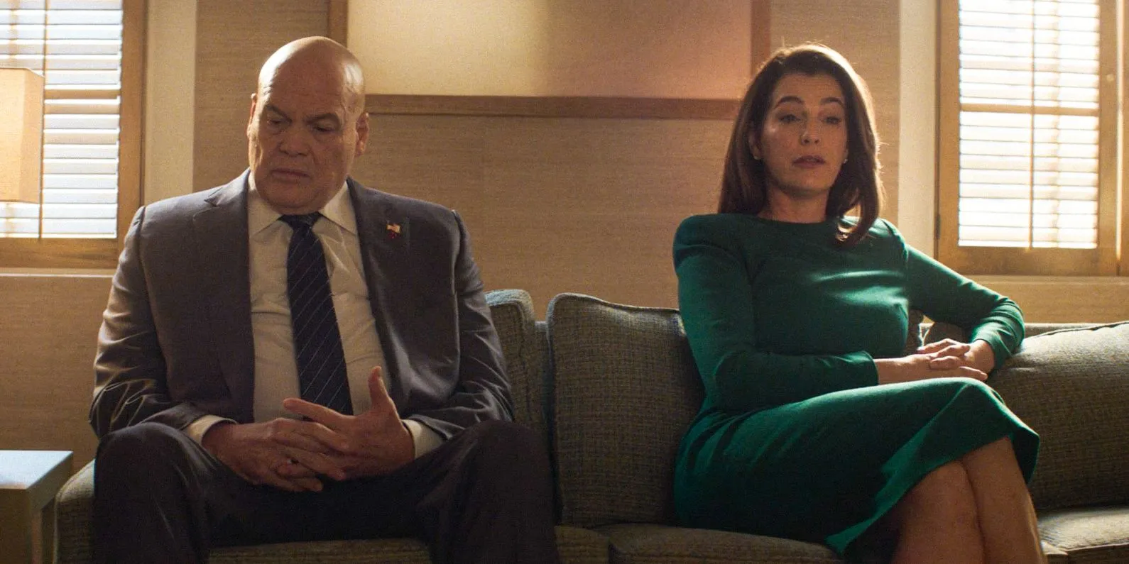 Wilson Fisk (Vincent D'Onofrio) and Vanessa (Ayelet Zurer) sitting on a couch in couples therapy in Daredevil: Born Again Season 1 Ep 4