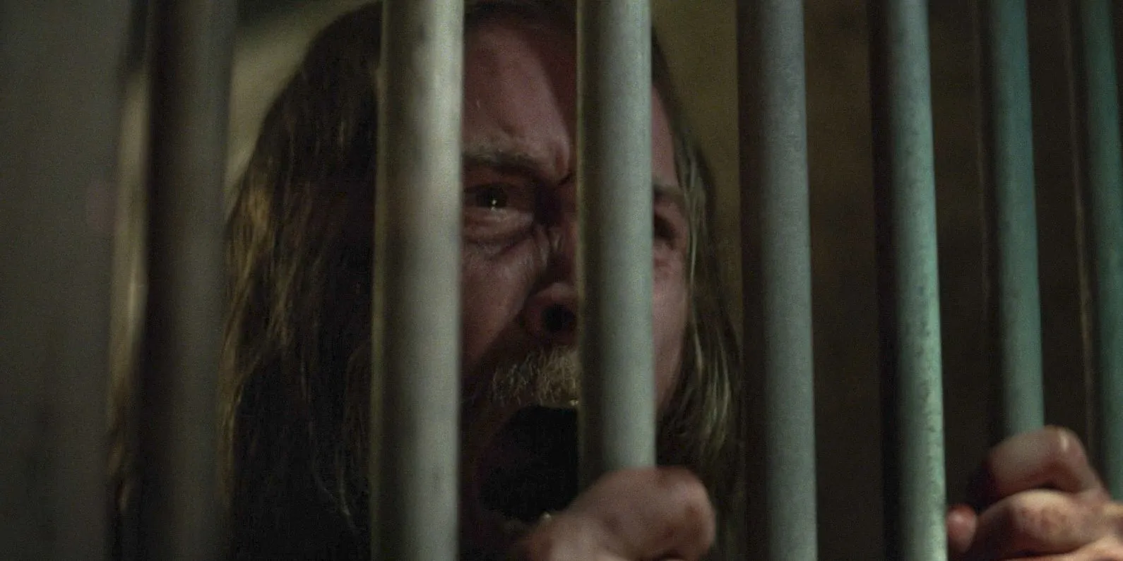 Adam (Lou Taylor Pucci) screams desperately behind bars in Daredevil: Born Again Season 1 Episode 4