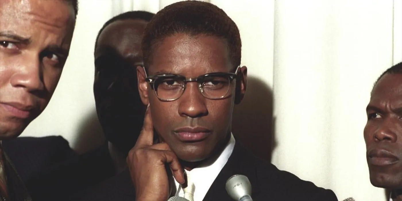 Malcolm X surrounded by reporters