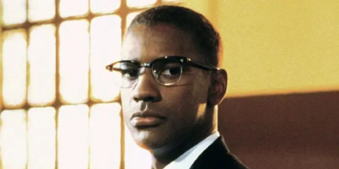 Denzel Washington looking over his shoulder as Malcolm X