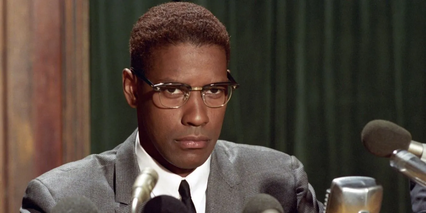 Denzel Washington prepares to address journalists in Malcolm X
