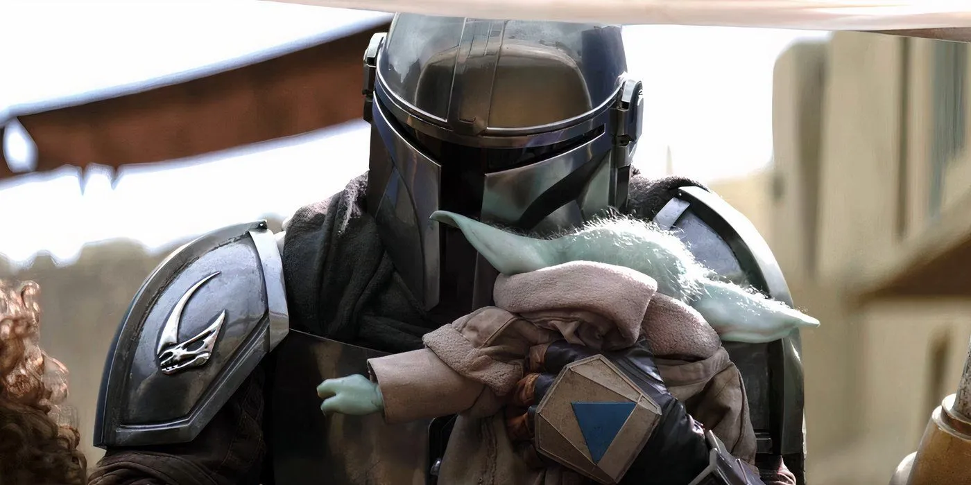 Din Djarin holding Grogu in The Mandalorian