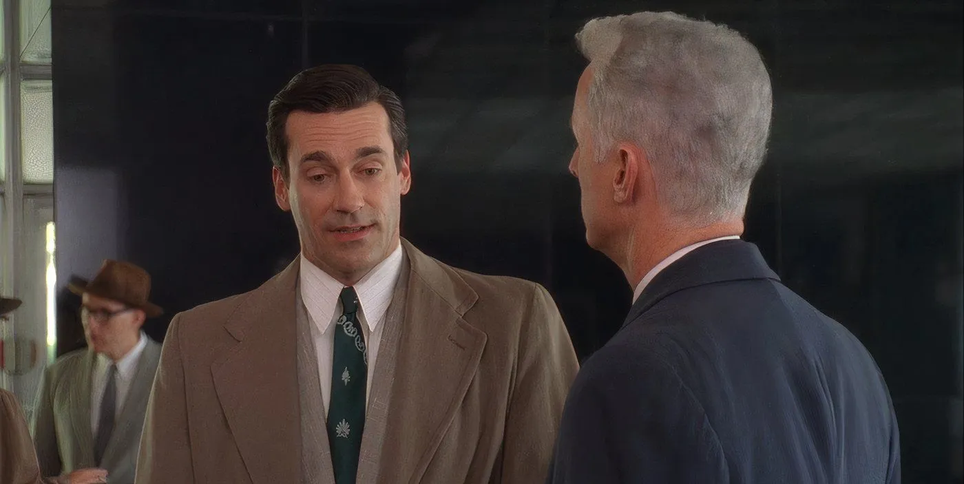 Don Draper conversing with Roger Sterling