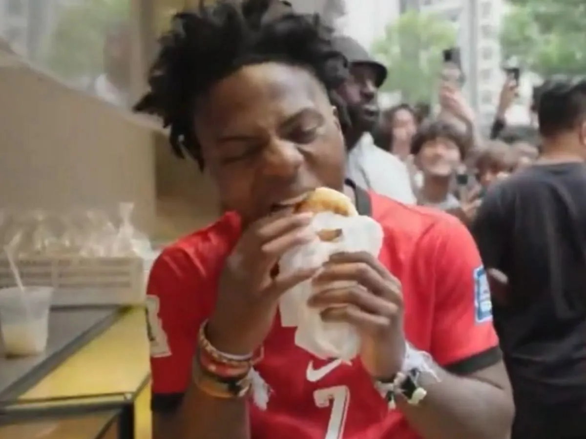 Speed tries out Hong Kong's signature Pineapple Bread (Image via X/@IShowSpeedHQ)
