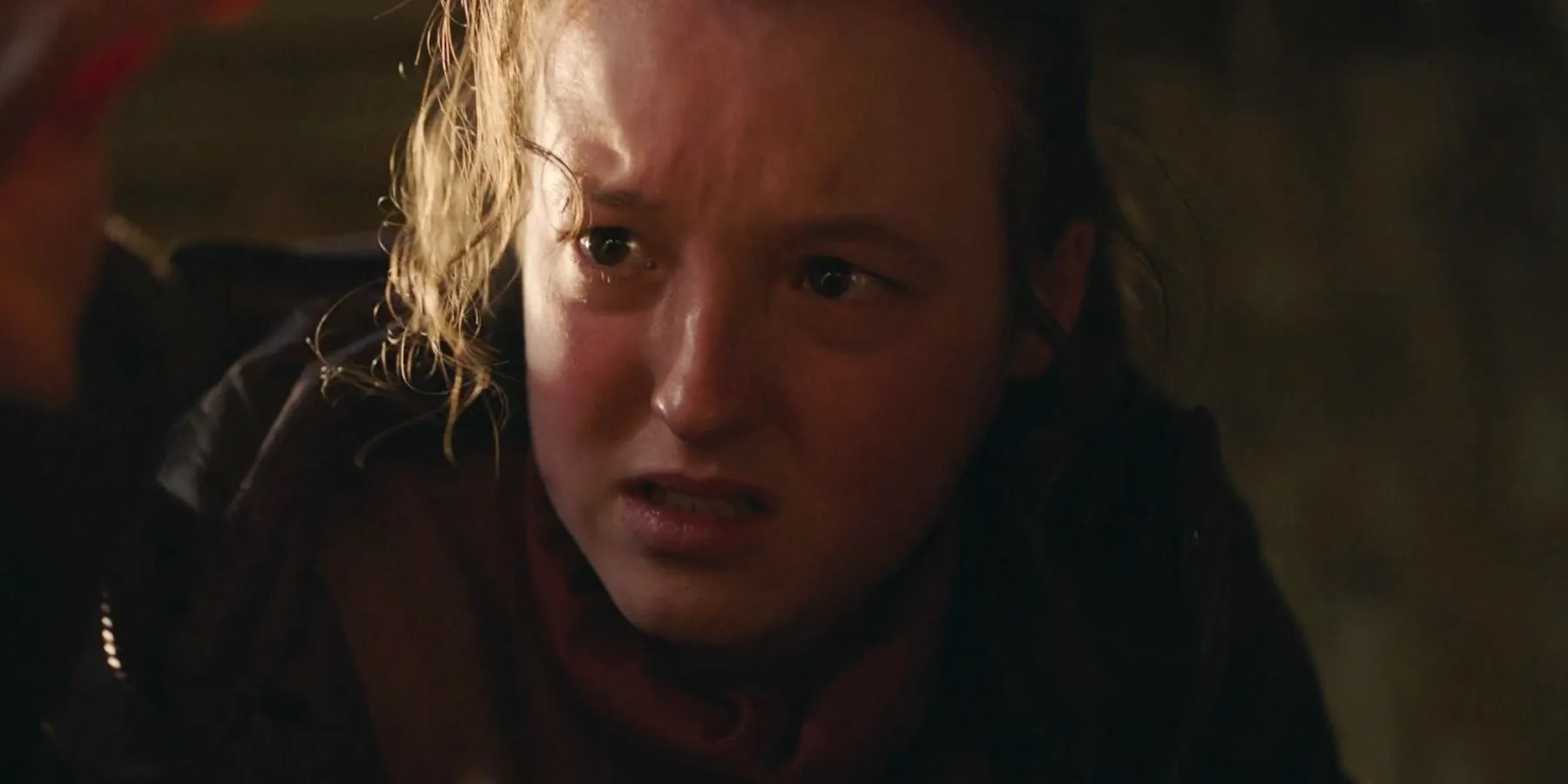 Bella Ramsey as Ellie in a tense moment Bella Ramsey as Ellie in a tense moment