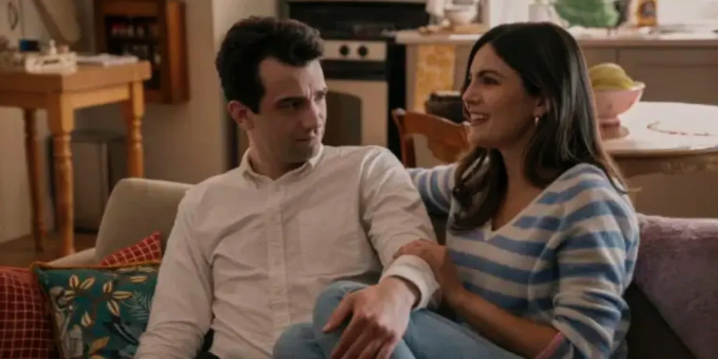 Carter sits on the couch with Emma in FUBAR Carter sits on the couch with Emma in FUBAR