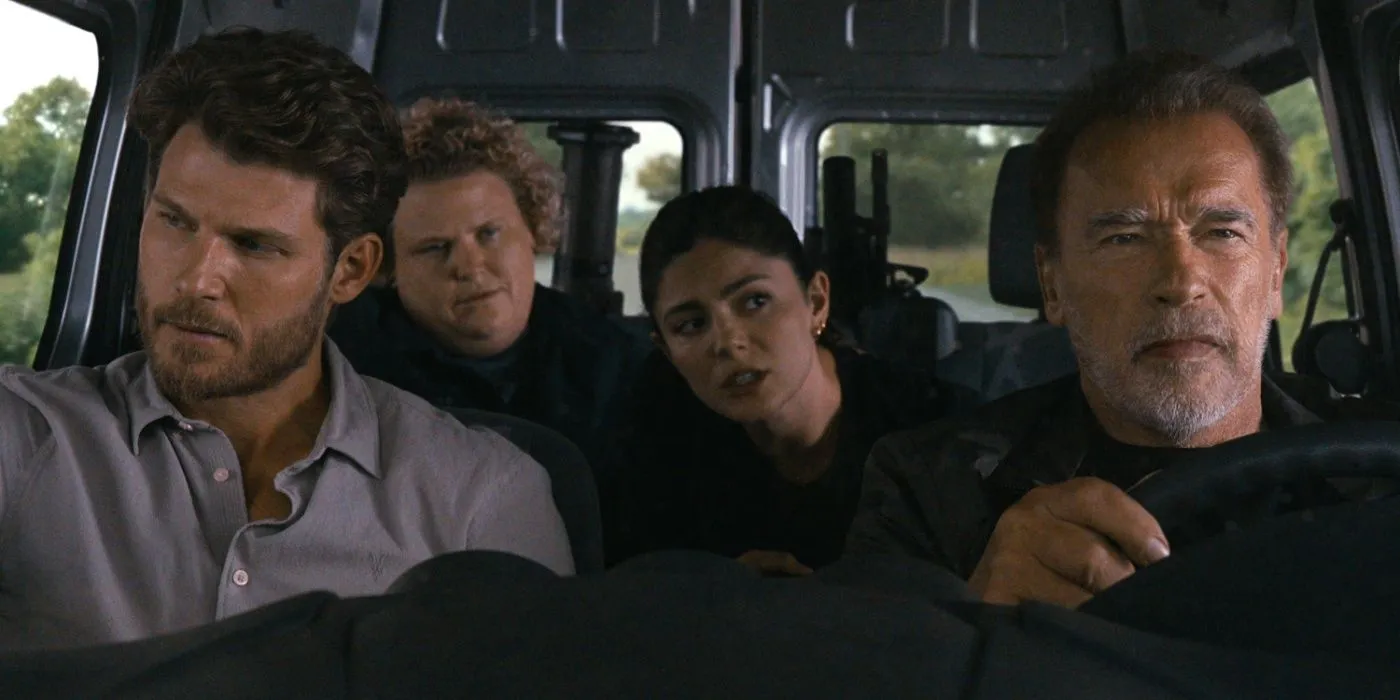 Luke drives with an angry expression while the rest of the cast of FUBAR look on. Luke drives with an angry expression while the rest of the cast of FUBAR look on.