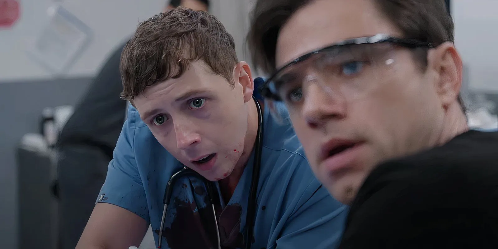Gerran Howell covered in blood next to another doctor in The Pitt Gerran Howell covered in blood next to another doctor in The Pitt