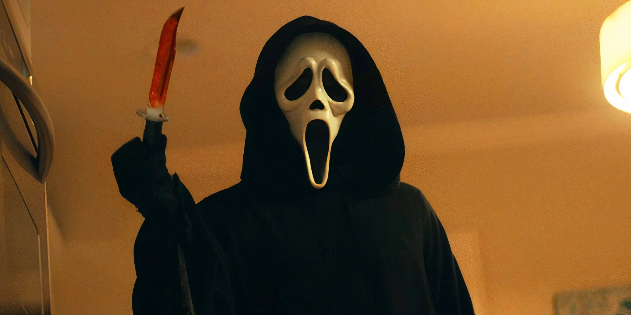 Ghostface holding a bloody knife in 2022's Scream Ghostface holding a bloody knife in 2022's Scream