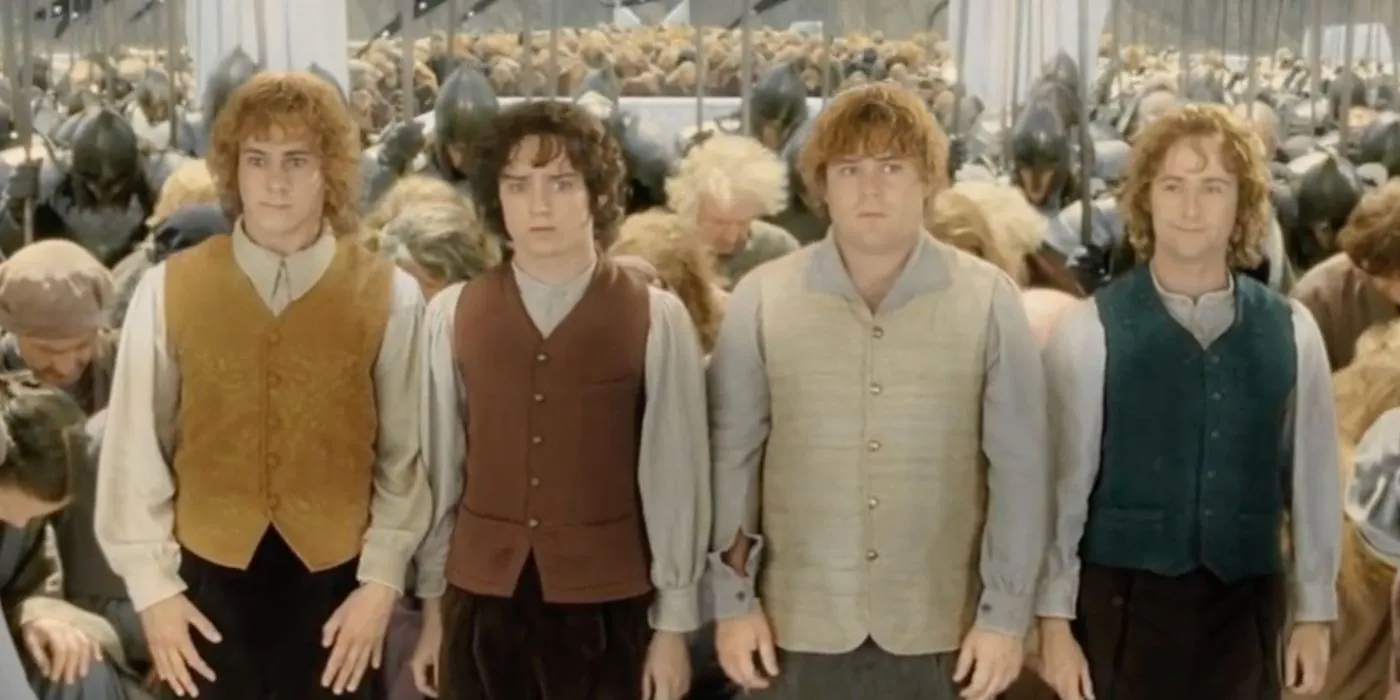 Hobbits standing as the royal court bows to them in the ending of The Lord of the Rings.