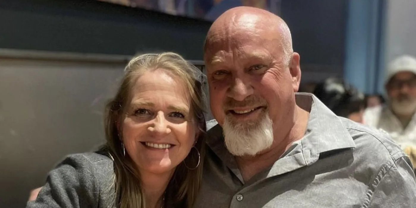 Christine Brown smiling with David Woolley. Christine Brown smiling with David Woolley.