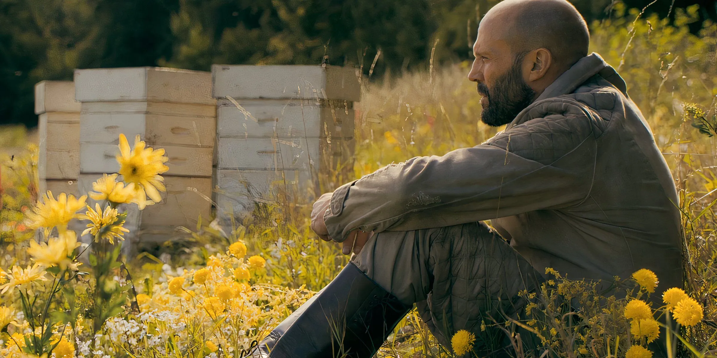 Jason Statham sitting in flowers in The Beekeeper Jason Statham sitting in flowers in The Beekeeper