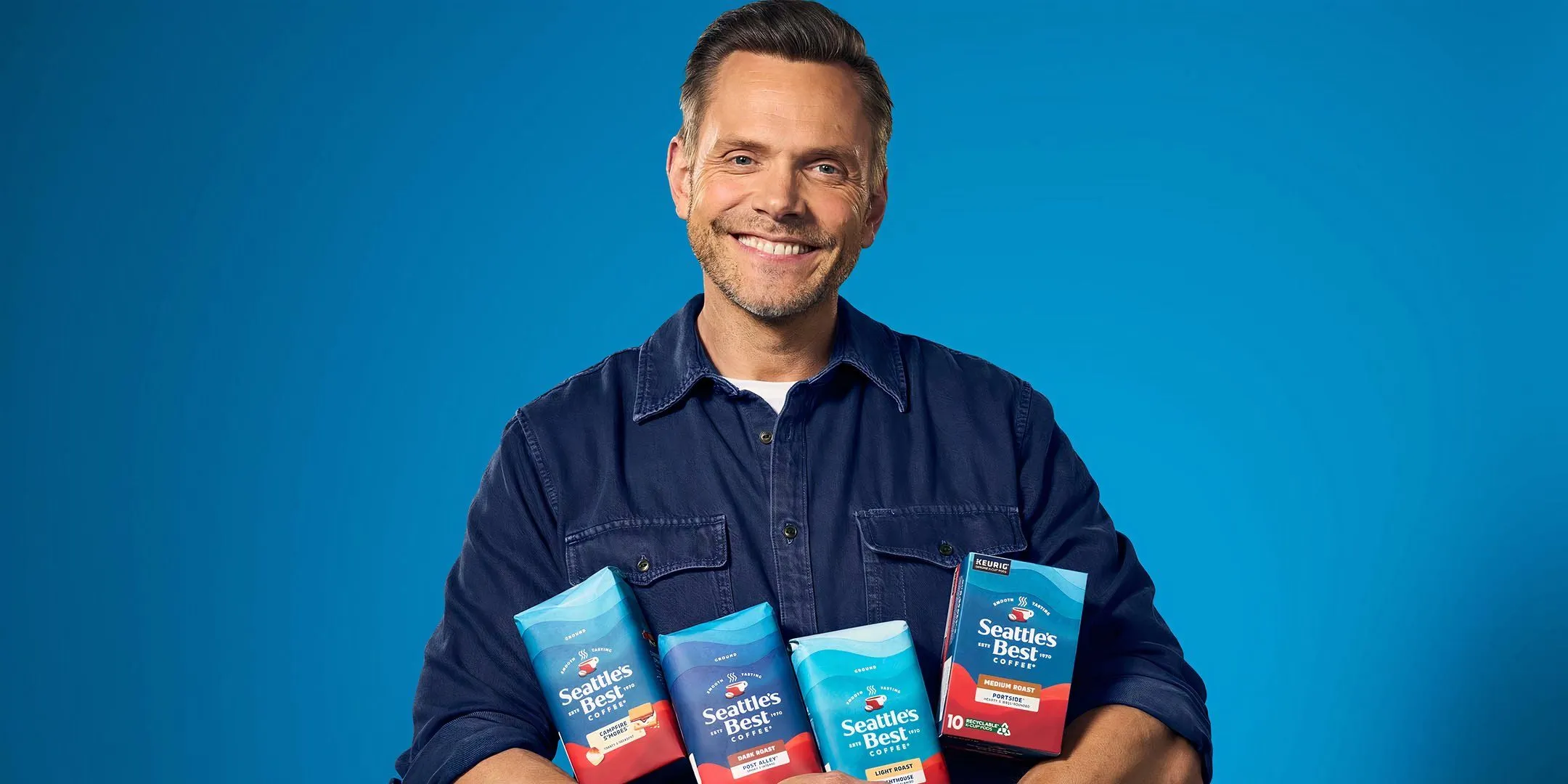 Joel McHale holding Seattle's Best Coffee bags Joel McHale holding Seattle's Best Coffee bags