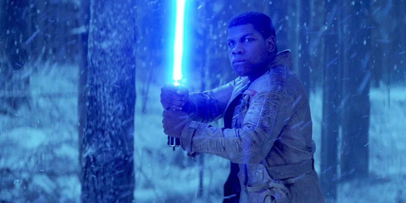 Finn wielding a lightsaber