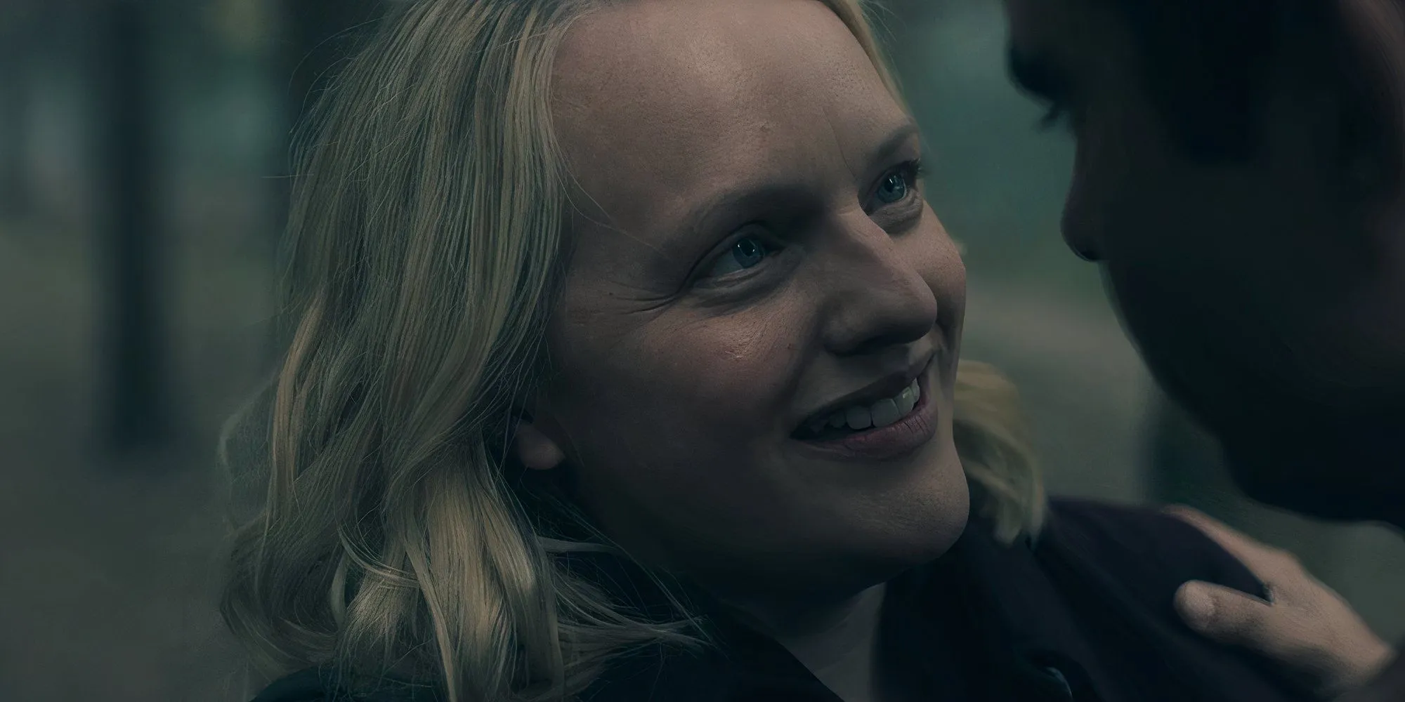 June smiling in The Handmaid's Tale